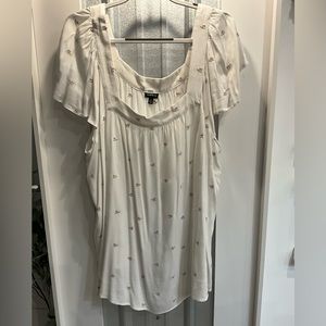 Torrid floral design white shirt.